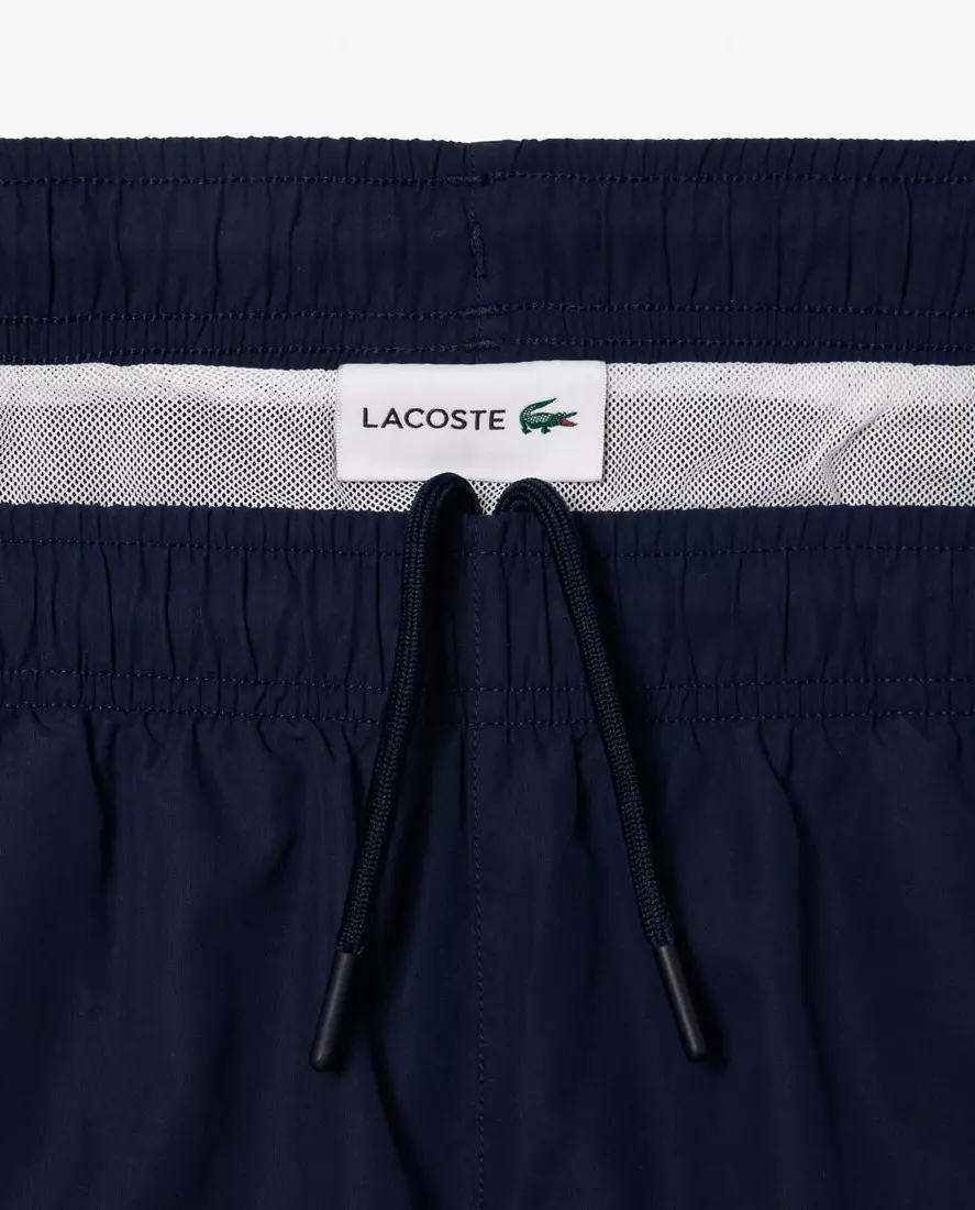 Темно-сині плавки LACOSTE з написом